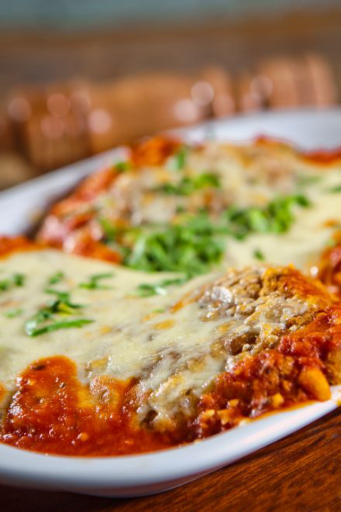 Bife milanesa à parmiggiana