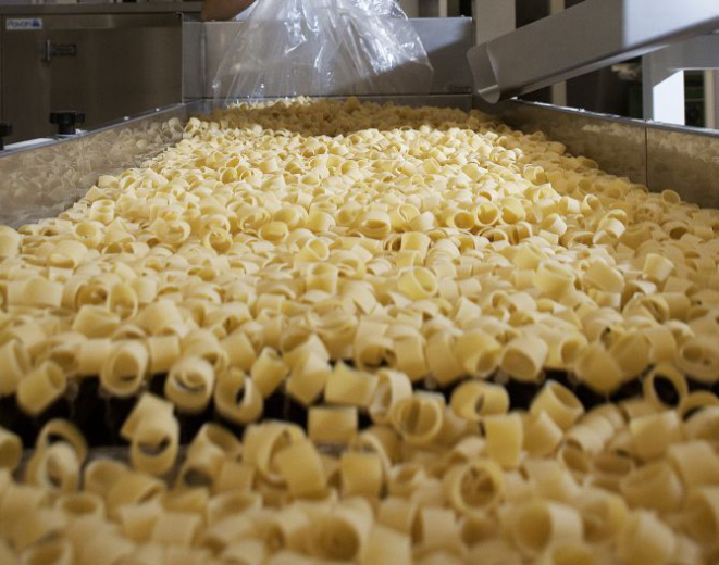 Pasta is loaded onto a conveyor for packaging at the Pastificio Felicetti factory, which began using only Italian-grown wheat in 2013, in Predazzo, Italy, Dec. 23, 2016. The company's decision to use durum wheat grown exclusively in Italy is paying off in flavor and sales, capitalizing on growing interest in expressions of terroir and feeding Italian pride at a time in which the country could use it. (Cristiano Bendinelli/The New York Times)