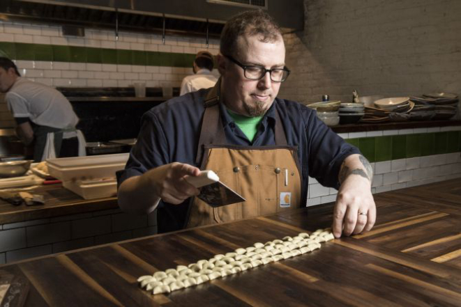 Kevin Adey, the chef at Faro, makes a dish of rye strascinati with venison ragu and celery root, in New York, Dec. 29, 2016. Riding a wave of interest in ancient grains, rye has recently been sprouting in many influential kitchens — in pasta, porridge, brownies and bread. (Evan Sung/The New York Times)