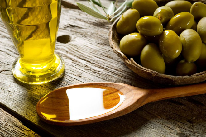 olive oil over spoon