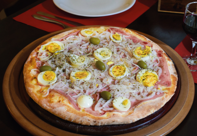 Pizza Portuguesa, do O Rei da Pizza. Foto: Divulgação.