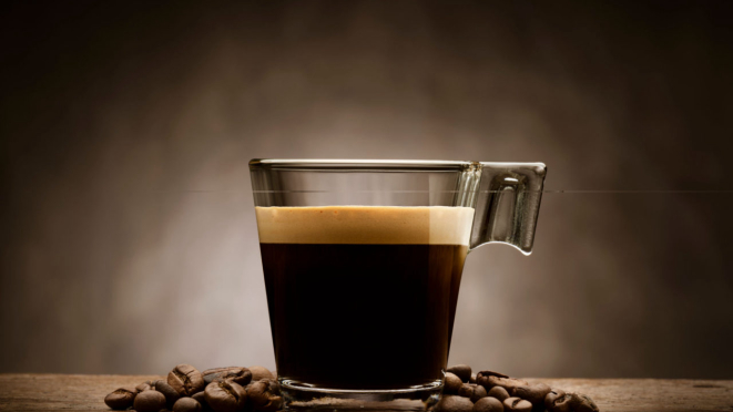 coffee cup on the wooden background, hot and fresh morning coffee. Coffee beans texture or coffee beans background. Brown roasted coffee beans. copyspace